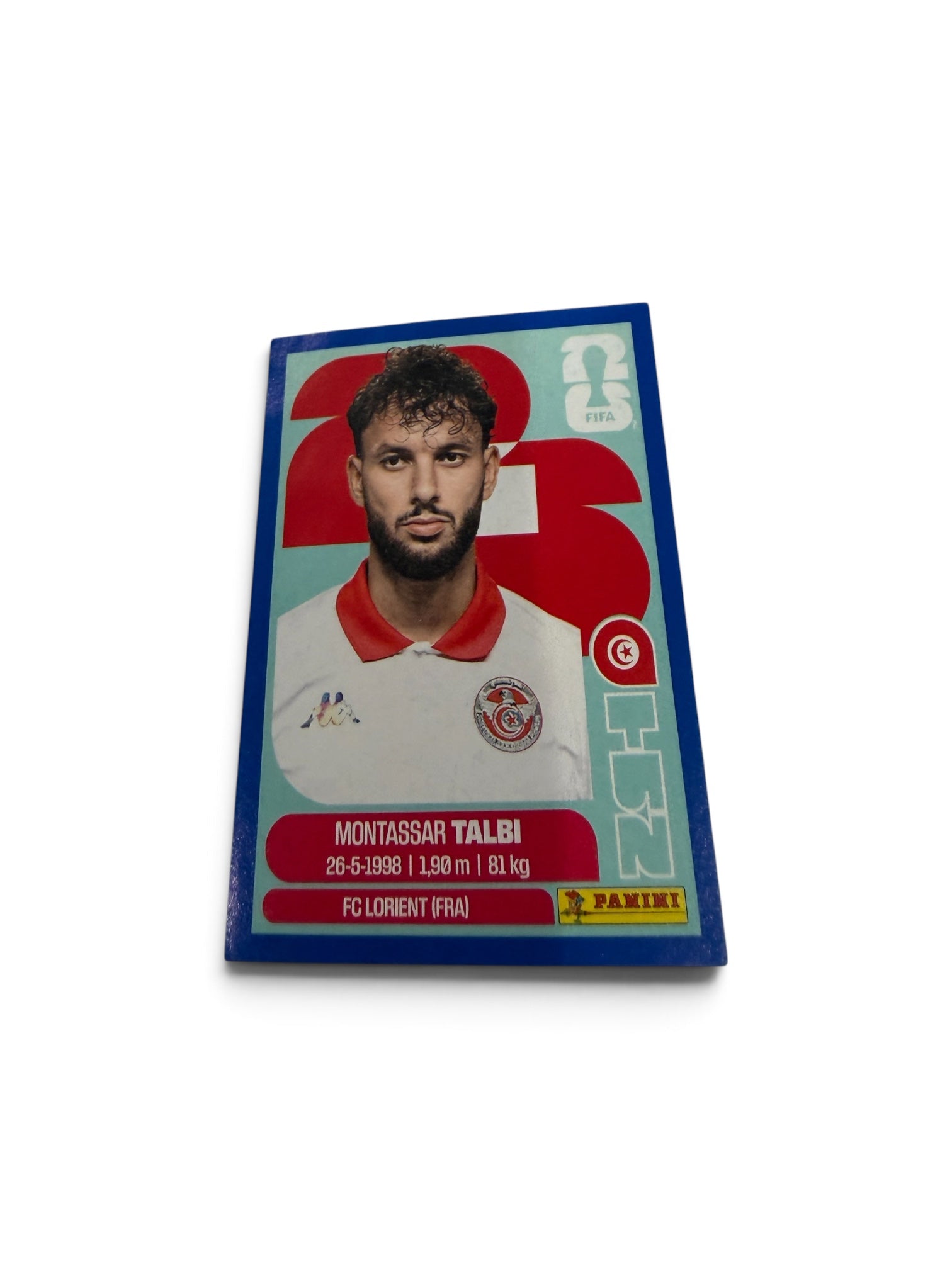 2026 Panini FIFA World Cup Montassar Talbi TUN5 Blue Border Parallel Sticker – Tunisia – FC Lorient – Official FIFA Licensed