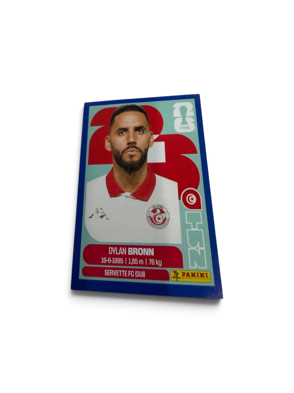 2026 Panini FIFA World Cup Blue Border Parallel Dylan Bronn #TUN8 Official Tunisia Sticker – Servette FC
